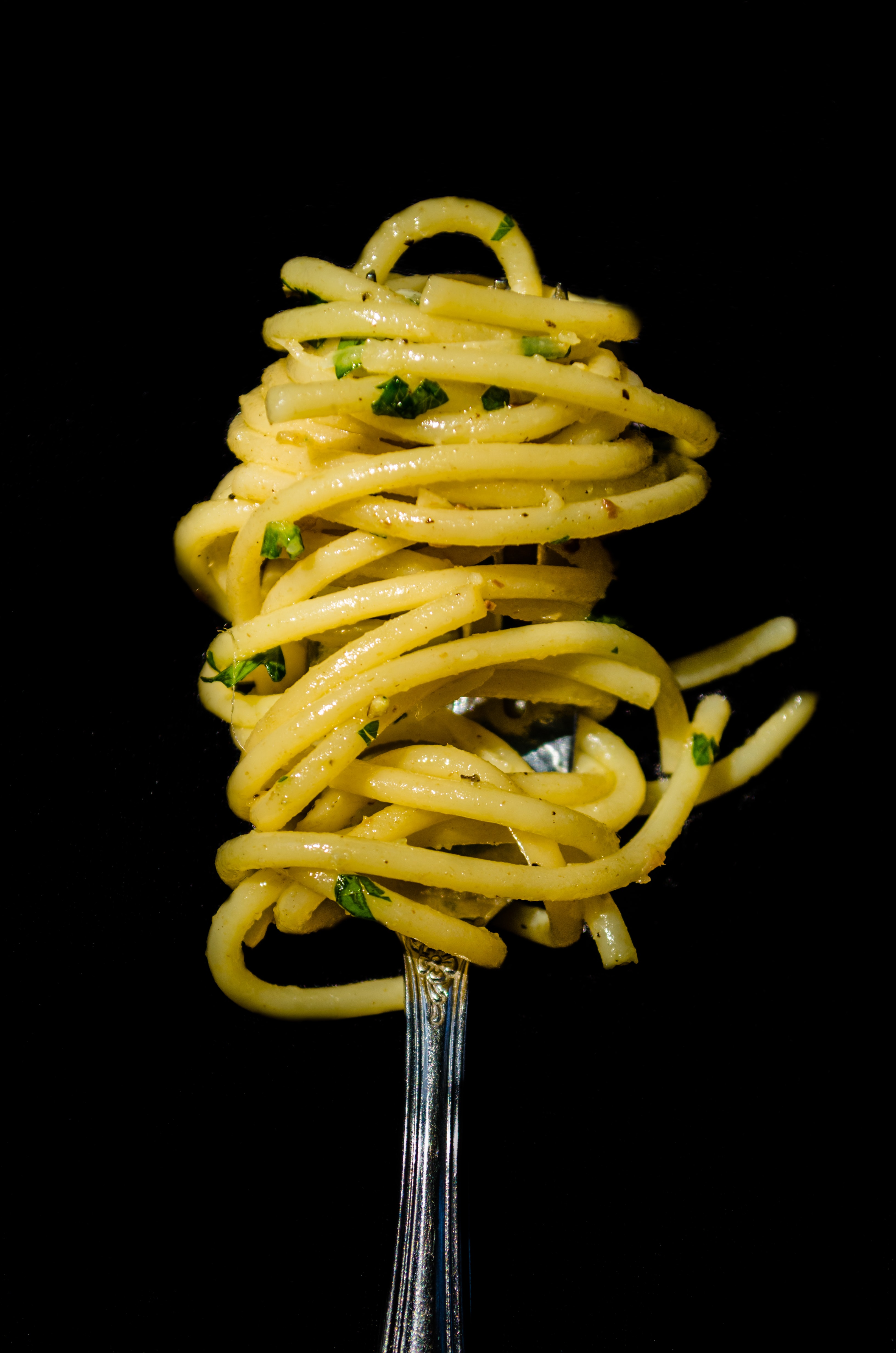 Garlicky pasta wrapped around a fork
